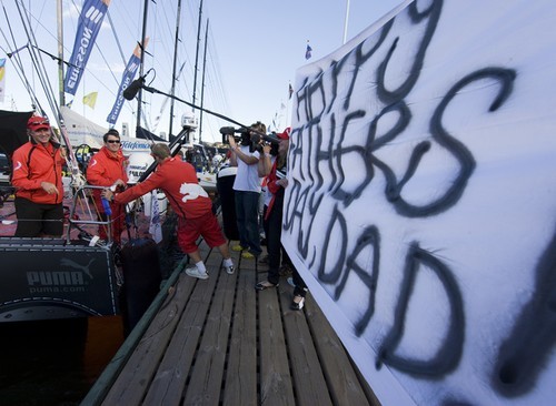 EDITORIAL USE only, please credit Sally Tori Read holds up a Happy Father’s Day banner for her Dad skipper Ken - Stockholm In Port race © Sally Collison/PUMA Ocean Racing http://www.sallycollison.com
